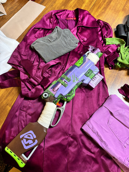Toy blaster on a purple jacket with clothes scattered around. Inspired by Daphne from Scooby Doo and the Apocolyptic Comic Book Series.