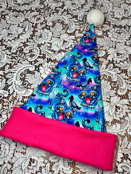 Pink fabric with a blue patterned fabric on top, on a lace background. Pattern is of Deroy Tiger from Kpop Demon Hunters