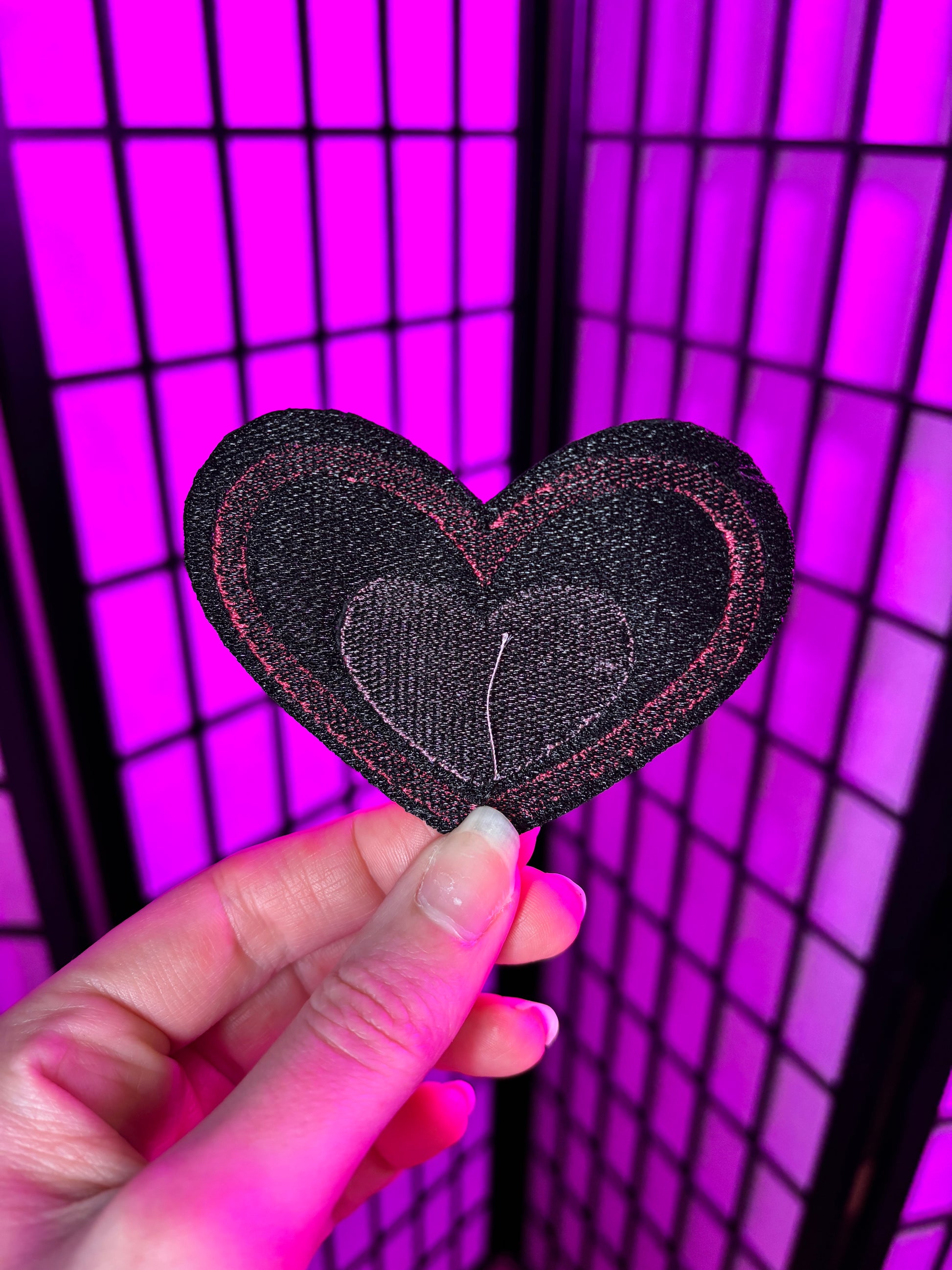 Back of the Valentine's Day Fizzarolli patch showing thread, not adheseive. This patch is sew on only. Inspired by Helluva Boss