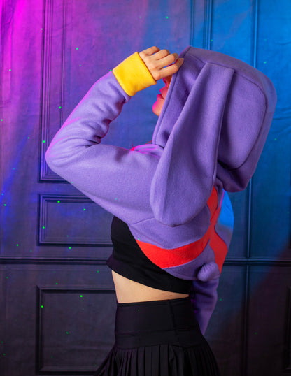 Person wearing a colorful hoodie with a vibrant background. Inspired by Jax from the Amazing digital circus