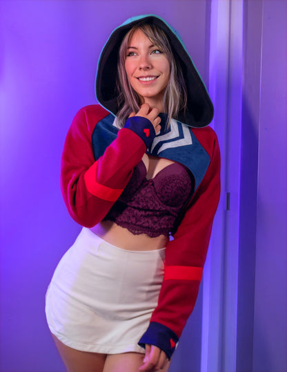 Asmodeus Cosplay cropped hoodie shrug inspired by Helluva Boss shown on a model with a purple background and matching outfit. 